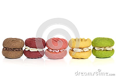 Row of Colorful Cream Cookies Isolated on White Stock Photo