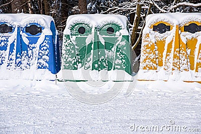 A row of colorful dustbins for waste segregation Stock Photo