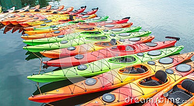 Row of colorful kayaks for rent in the water Editorial Stock Photo