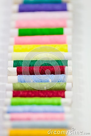 Colorful threads on bobbins Stock Photo