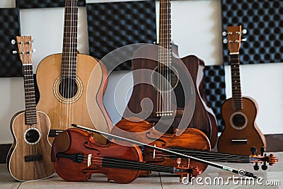Row of different musical string instruments for a school of music Stock Photo