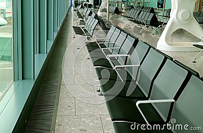 Row of empty chairs in the departure lounge of the airport Stock Photo