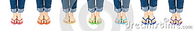 Row of Feet Wearing Colorful Flip Flops Stock Photo