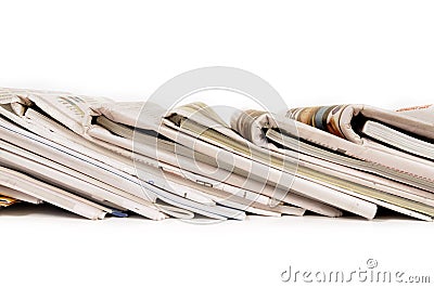 Row of folded newspapers, stacked leaning, isolated on white background Stock Photo