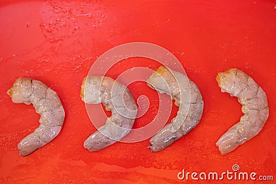 The row Fresh Shrimp in red plate background for cook Stock Photo