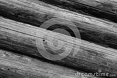 Row of gray round logs horizontal weathering surface cracked old rustic background base monochrome Stock Photo