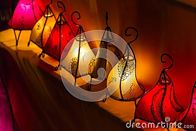Row of handcrafted colorful glowing lanterns Stock Photo