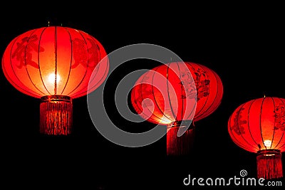 Row of illuminated chinese lanterns on dark background Stock Photo