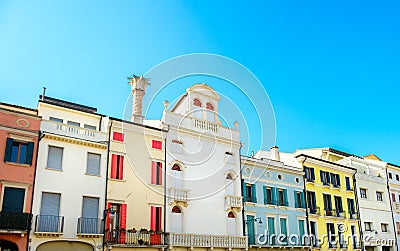 Row of Italian residential buildings colorful blue sky european flat colorful terraced houses historic Stock Photo