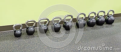 Row of Kettlebells at Fitness Center Stock Photo