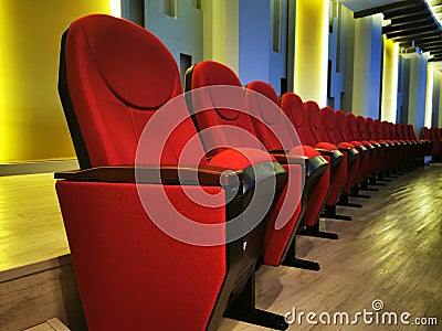 Row of Large red chair for watching movies in cinemas or theaters Stock Photo
