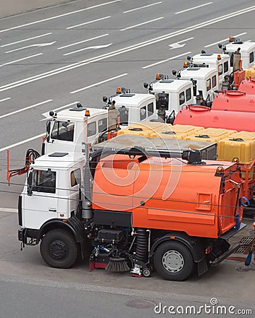 Row of many Watering cars on road Stock Photo