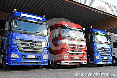 Row of Mercedes-Benz Actros Trucks in Carport Editorial Stock Photo