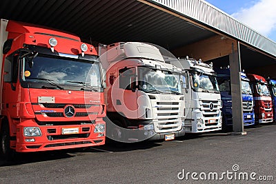 Row of Mercedes-Benz Actros Trucks in Carport Editorial Stock Photo