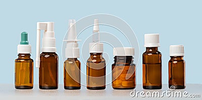 Group of mockup medical pills containers and nasal throat sprays Stock Photo