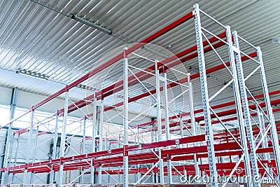 Row of mpty warehouse racks, Empty metal shelf in storage room Stock Photo