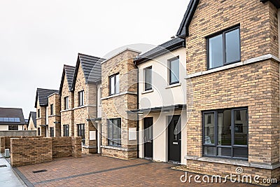 Row of newly built houses for sale Stock Photo