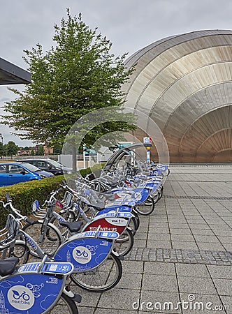 A Row of Next Bikes ready for Hire at the Glasgow Science Centre on Pacific Quay in Glasgow. Editorial Stock Photo