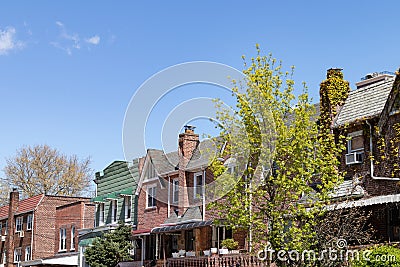 Row of Old Brick Homes in Astoria Queens New York during Spring Editorial Stock Photo