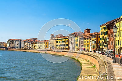 Row of old colorful buildings houses on embankment promenade of Arno river in historical centre of Pisa Stock Photo