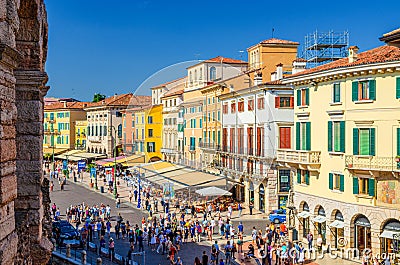 Row of old colorful multicolored buildings on Piazza Bra square Editorial Stock Photo