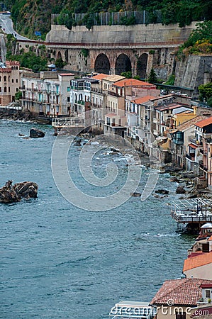Row of old italian houses fronting the ocean in Stock Photo