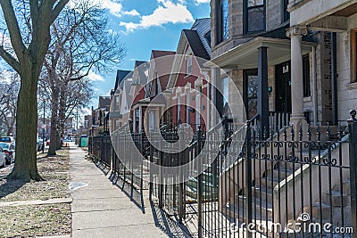 A Row of Fenced In Homes in Logan Square Chicago Stock Photo