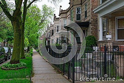 Row of Old Fenced in Homes in Logan Square Chicago Stock Photo