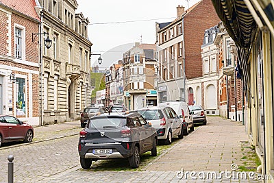 Row of Parked Cars Along Roadside Editorial Stock Photo