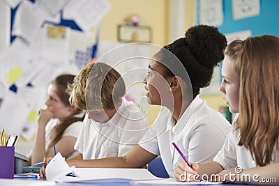 A row of primary school children in class, close up Stock Photo