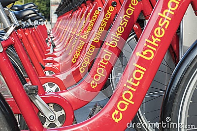 Row of Red Bicycles Used in the Capital Bikeshare Program Resting on the sidewalk #3 Editorial Stock Photo