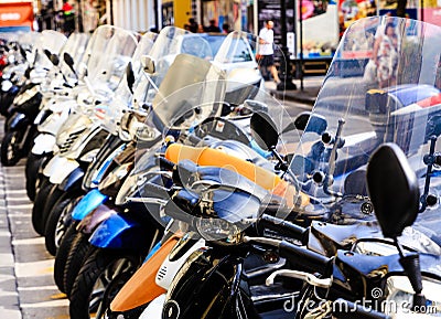 Row of Scooters with Windscreens Editorial Stock Photo