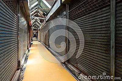 Row of shop business closed metal roller shutters Stock Photo