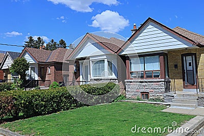 Row of small brick bungalow houses Stock Photo