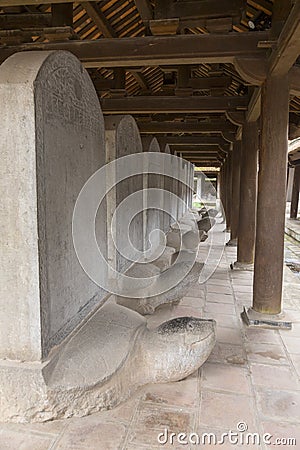 Row of stone stelae atop turtle statues, Temple of Literature, Hanoi, Stock Photo