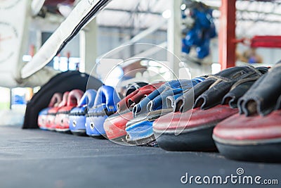 Row of thai Boxing Mitt Training Target Focus Punch Pad Glove on Stock Photo