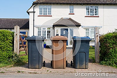Row of three wheelie bins outside a house Editorial Stock Photo