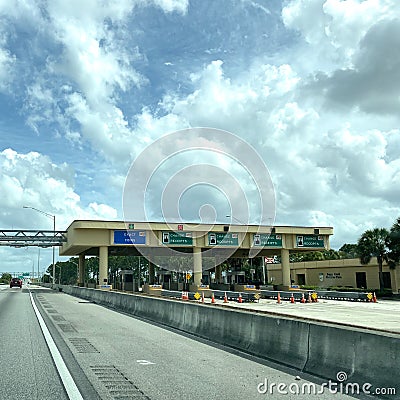 A row of toll booths for people to pay tolls for EPass and Sunpass in Orlando, Florida Editorial Stock Photo