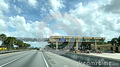 A row of toll booths for people to pay tolls for EPass and Sunpass in Orlando, Florida Editorial Stock Photo