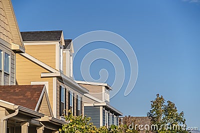 Row of upper floor facades of urban homes Stock Photo