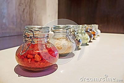 Row of Various Dry Ingredients and Herbs for Thai Food Recipe in The Glass Bottle, Selective Focus Stock Photo