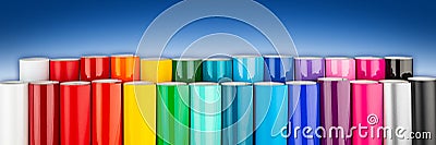 Row of various rainbow colored vinyl car wrapping or plotter cutting sticker foil film rolls blue white wide panorama banner Stock Photo