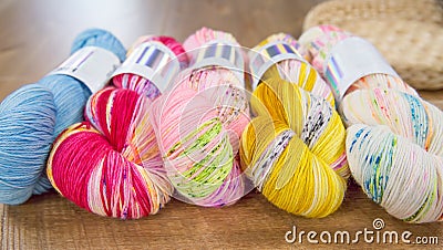 Row of vibrant variegated yarn skeins Stock Photo