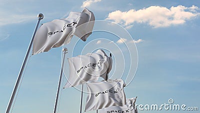 Row of waving flags with Space Exploration Technologies Corp. or SpaceX logo. Editorial 3D rendering Editorial Stock Photo
