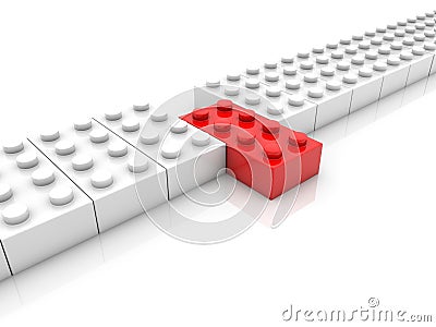 Row of whites toy bricks with red one in the middle Stock Photo