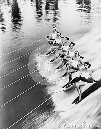 Row of women water skiing Stock Photo