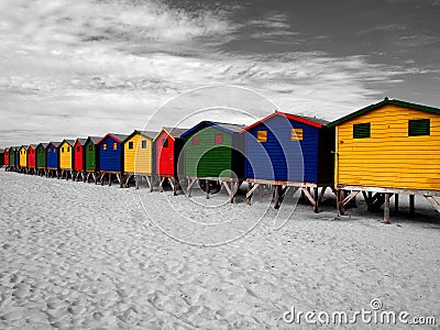 The row of wooden brightly colored huts. Stock Photo