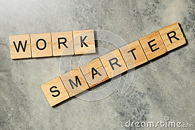 The row of wooden cubes with 'work smarter' text Stock Photo