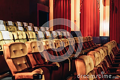 A row of yellow seat in the movie theater Stock Photo