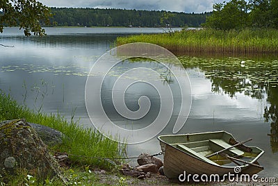 Rowboat at shore Stock Photo